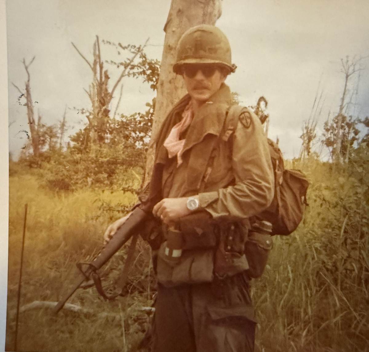 Capt. Mac McLaughlin in the field wearing the pink scarf